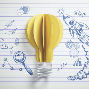 Bild zum Workshop "Mit Luft MINT machen", zeigt eine Glühbirne aus Papier, mit Zeichnungen von Raketen, Fliegern und Wolken